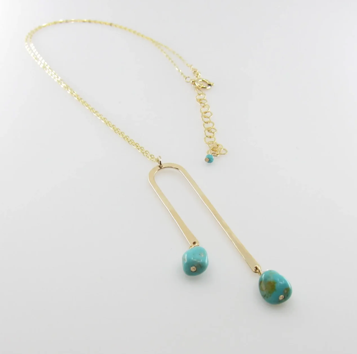 Necklace with Asymmetrical Arch Pendant and Kingman Turquoise Drops
